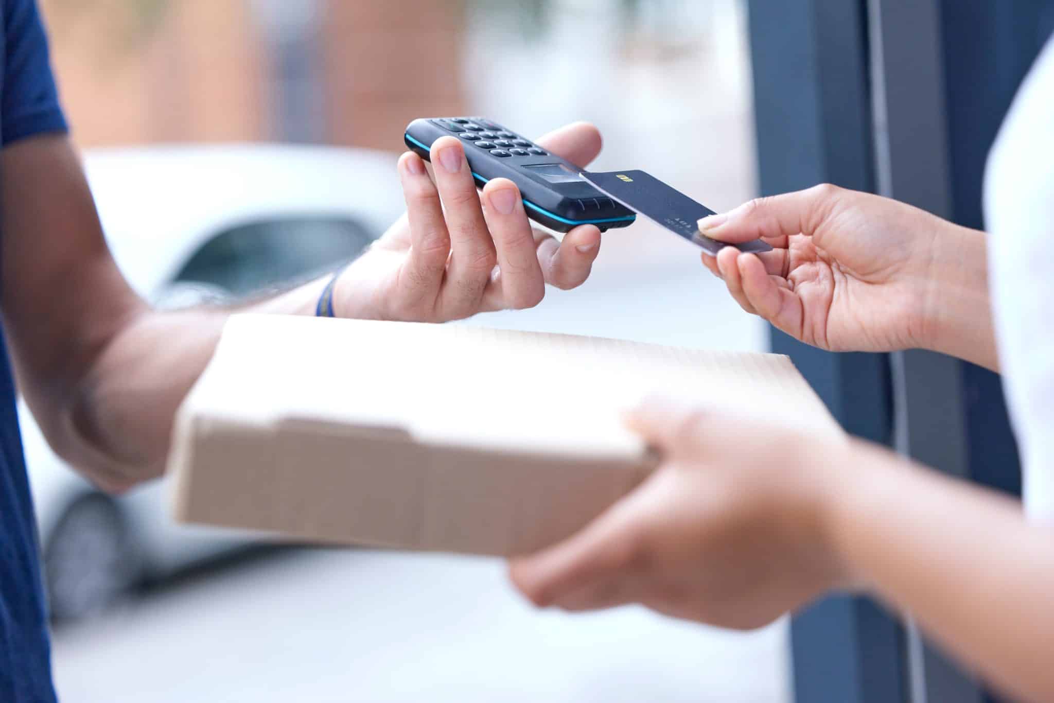 Card machine, courier and people hands with online payment, digital finance service and paperless f