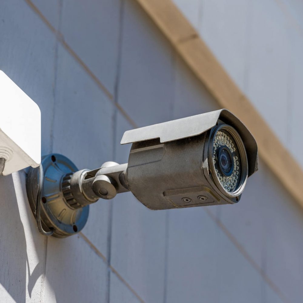 close up of security camera on wall, security system concept