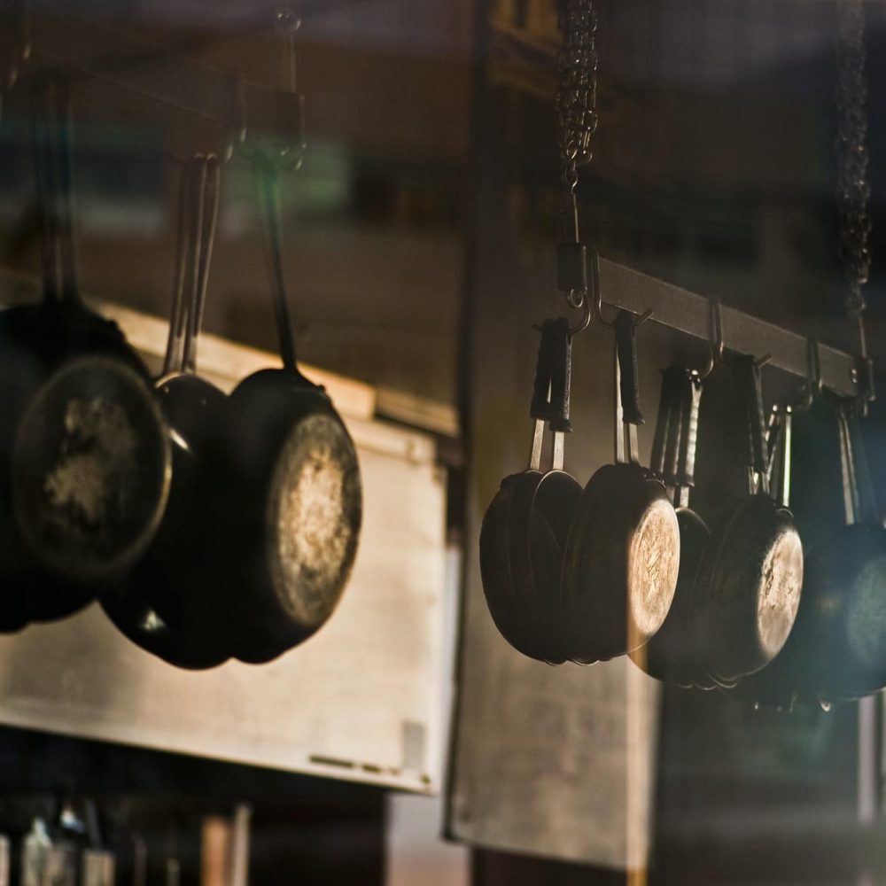 Pans hanging in commerical kitchen.
