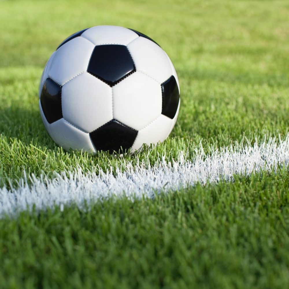 Soccer Ball on Grass Field with Stripe